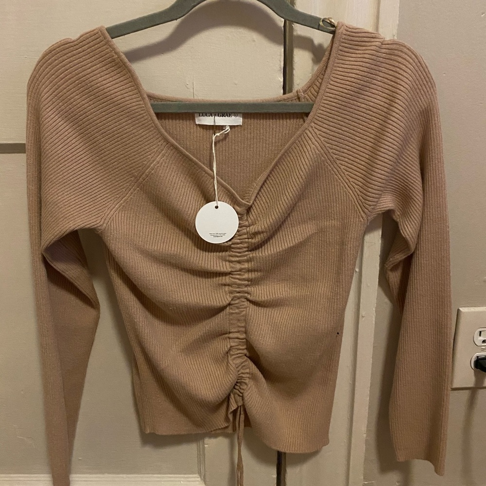 Brand new long sleeve cinched in the front shirt